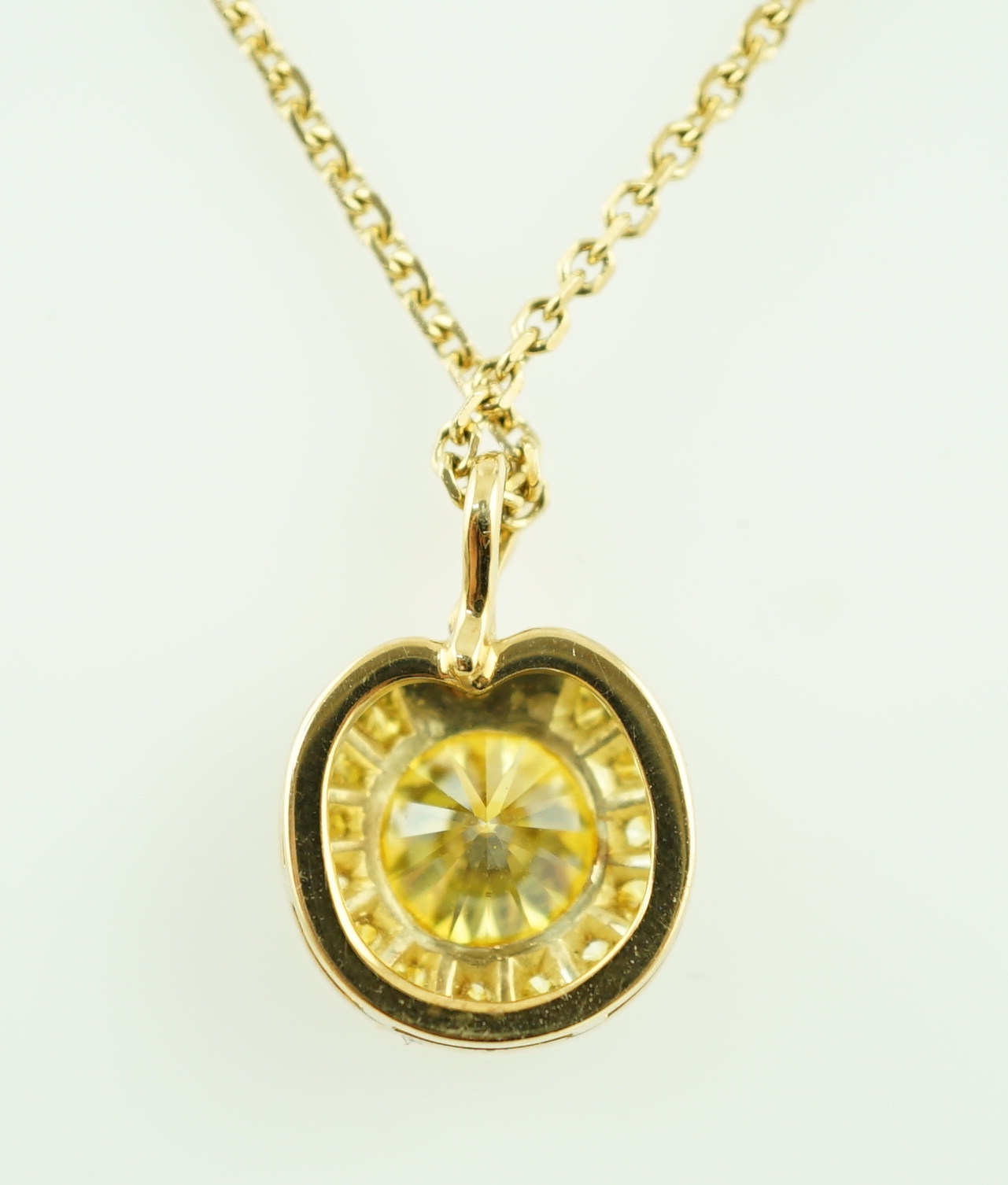 A modern Boodles 18ct gold fancy vivid yellow diamond cluster set pendant necklace on a two stone diamond set chain, with clasp and Boodles ring set with small brilliants